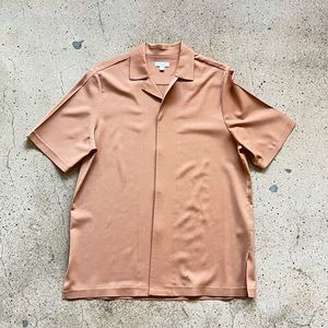 Large oversized beige wool short sleeved shirt from COS.